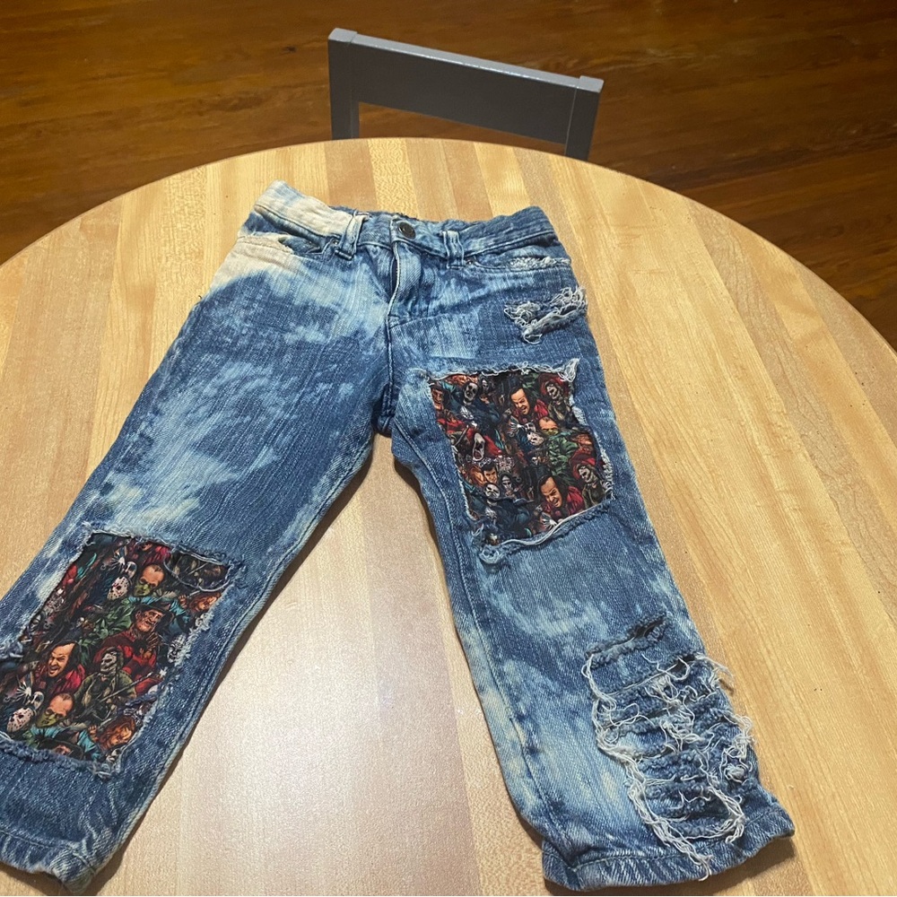 Distressed Blue Jeans with Graphic Patches